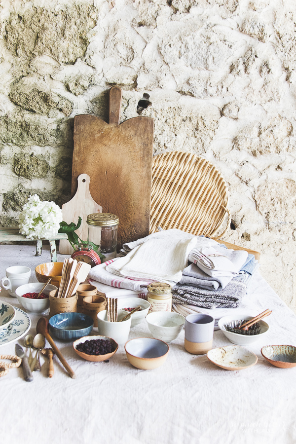 Creative styling with cutting board and various food items.