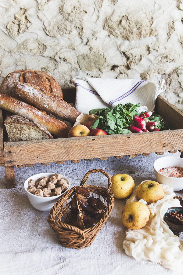 Fresh dates, sugar cubes, apples and salt on the table.