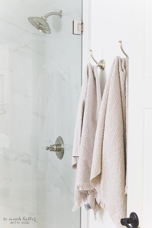 Polished nickel hooks and shower head from Delta faucet.