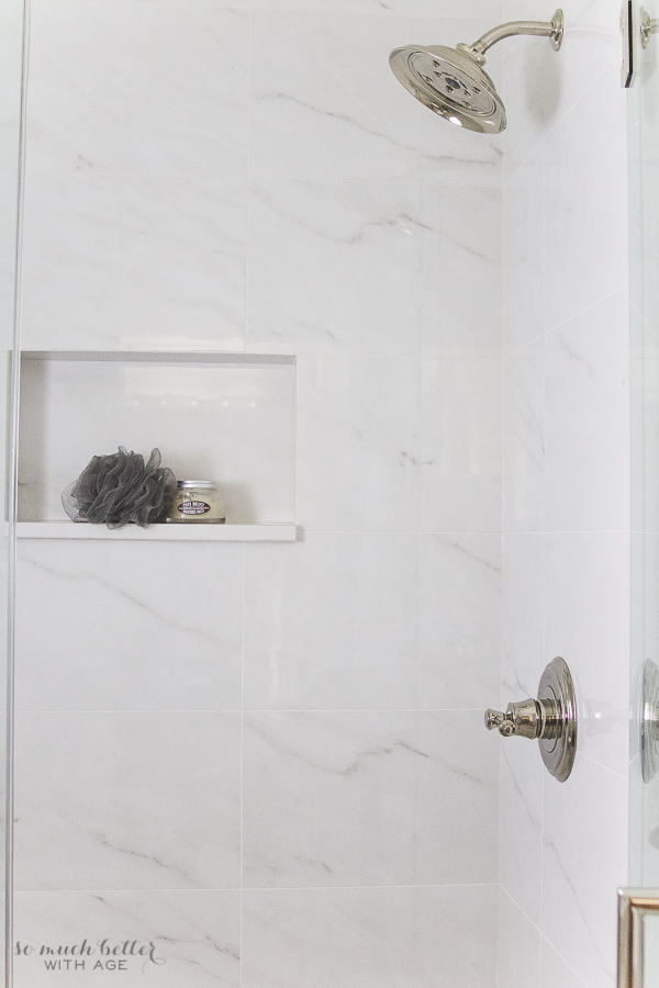 Porcelain tile that looks like real marble in the primary bathroom.