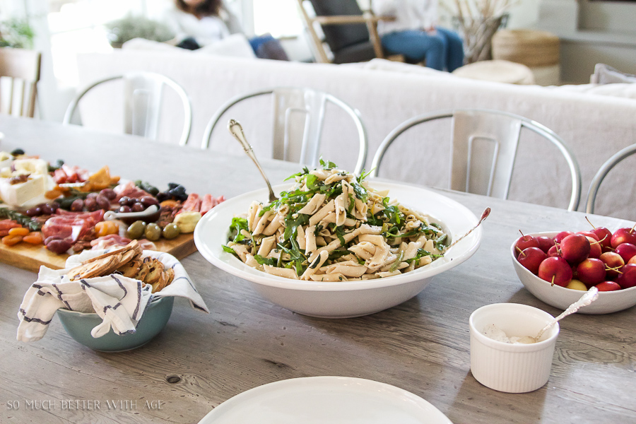 A large bowl of pasta and bread.