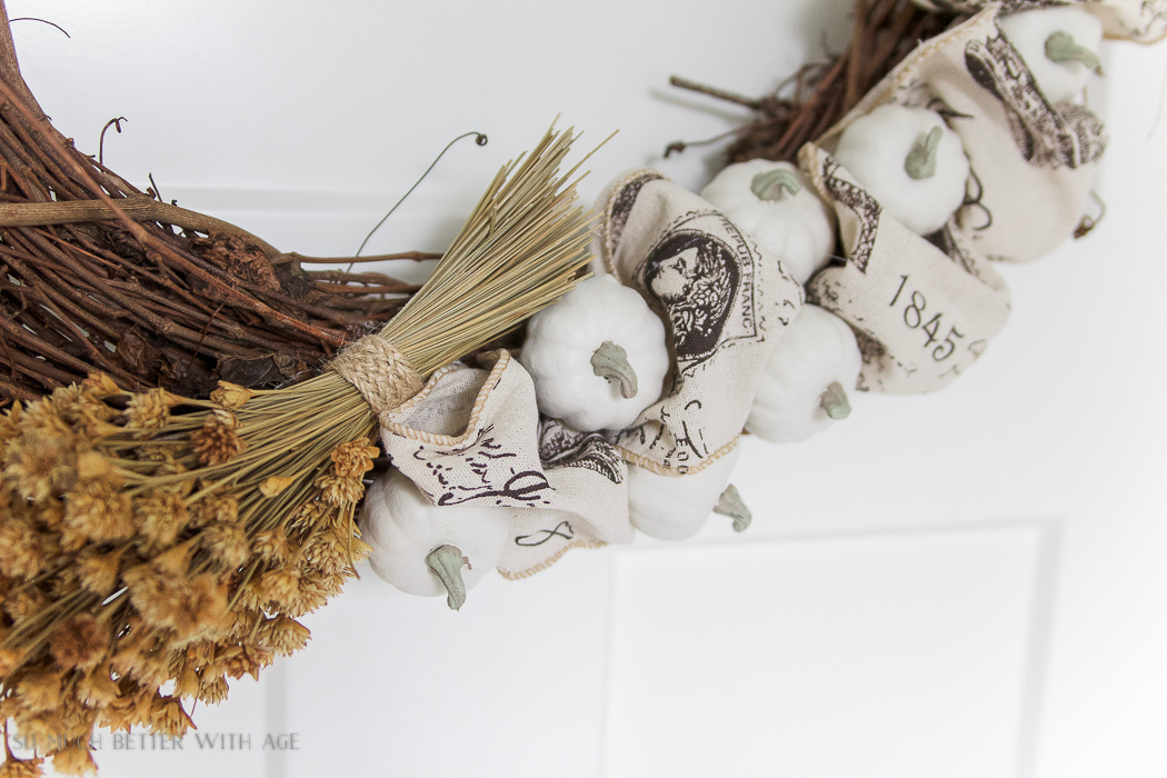 Dried fall flowers on grapevine wreath.