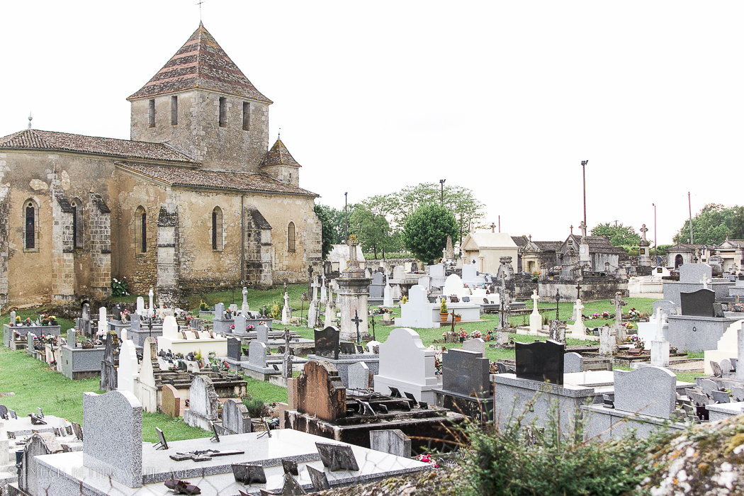  Stone church and cemetery French countryside.