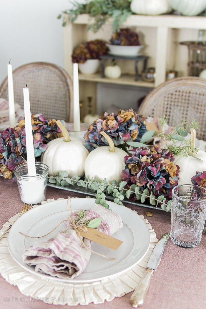 White plates and ruffled placemats on the table.