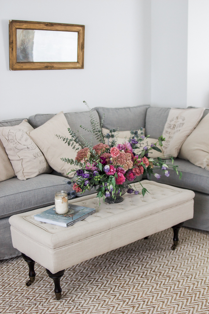 Flowers on the ottoman.