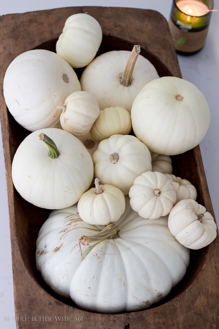 White pumpkins in dough bowl.