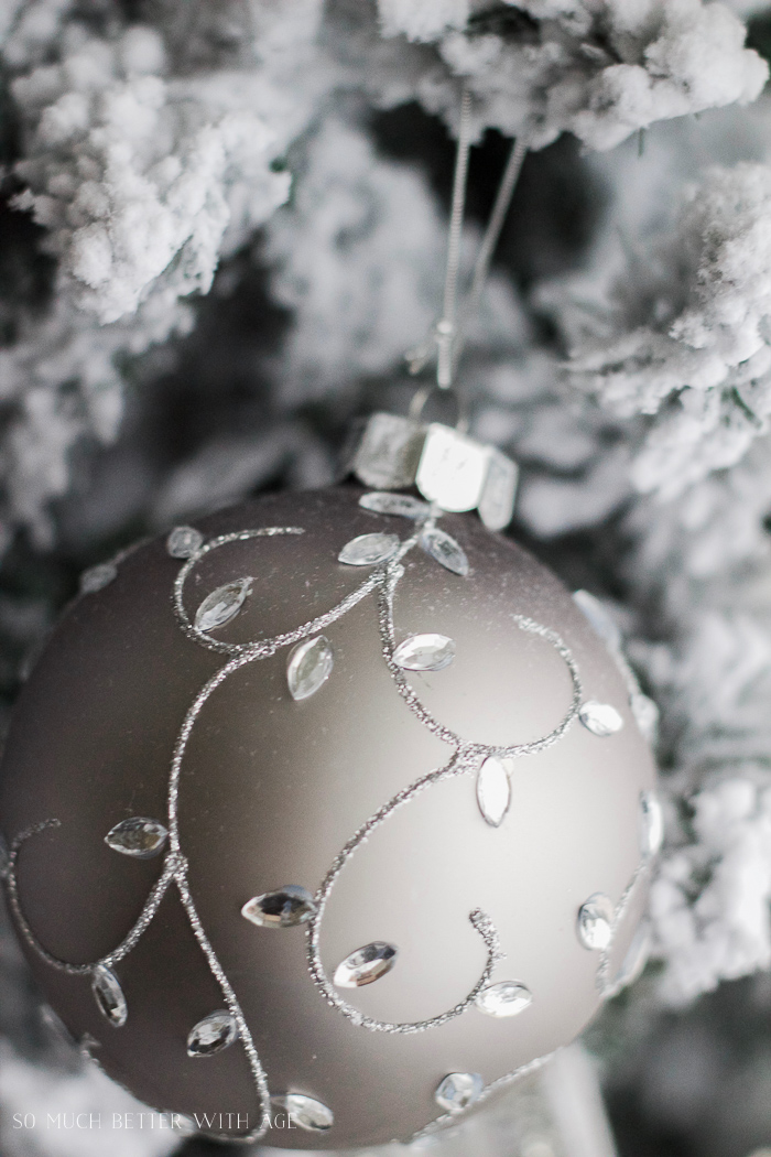 Jewel and glitter ornament on the tree.