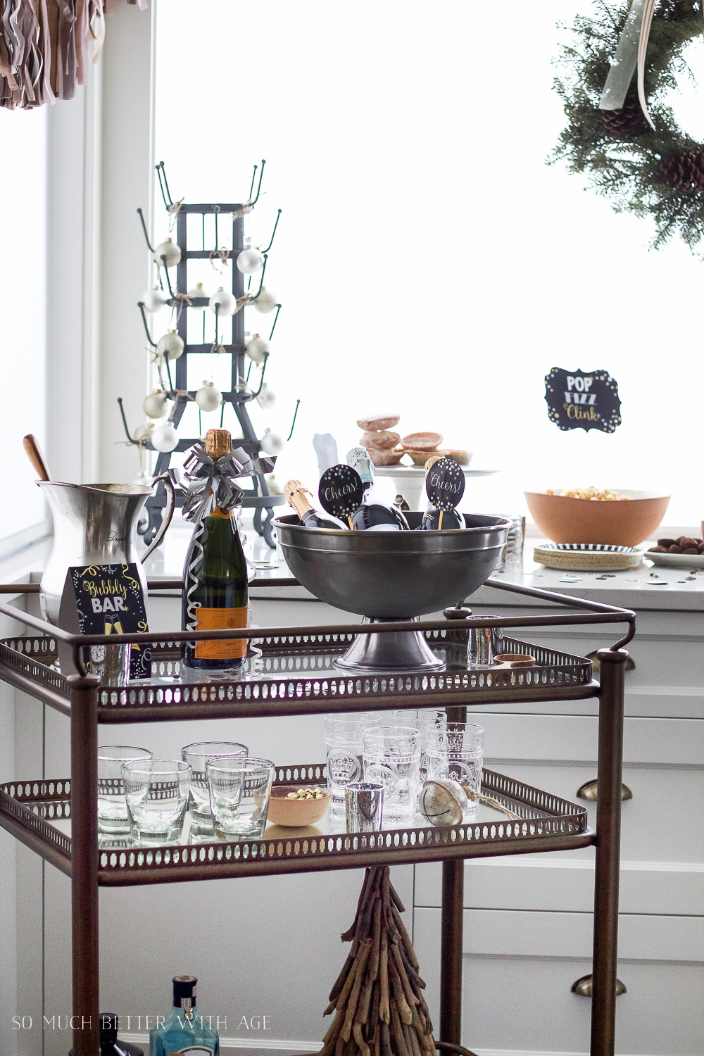 A bottle of Veuve on the bar cart.