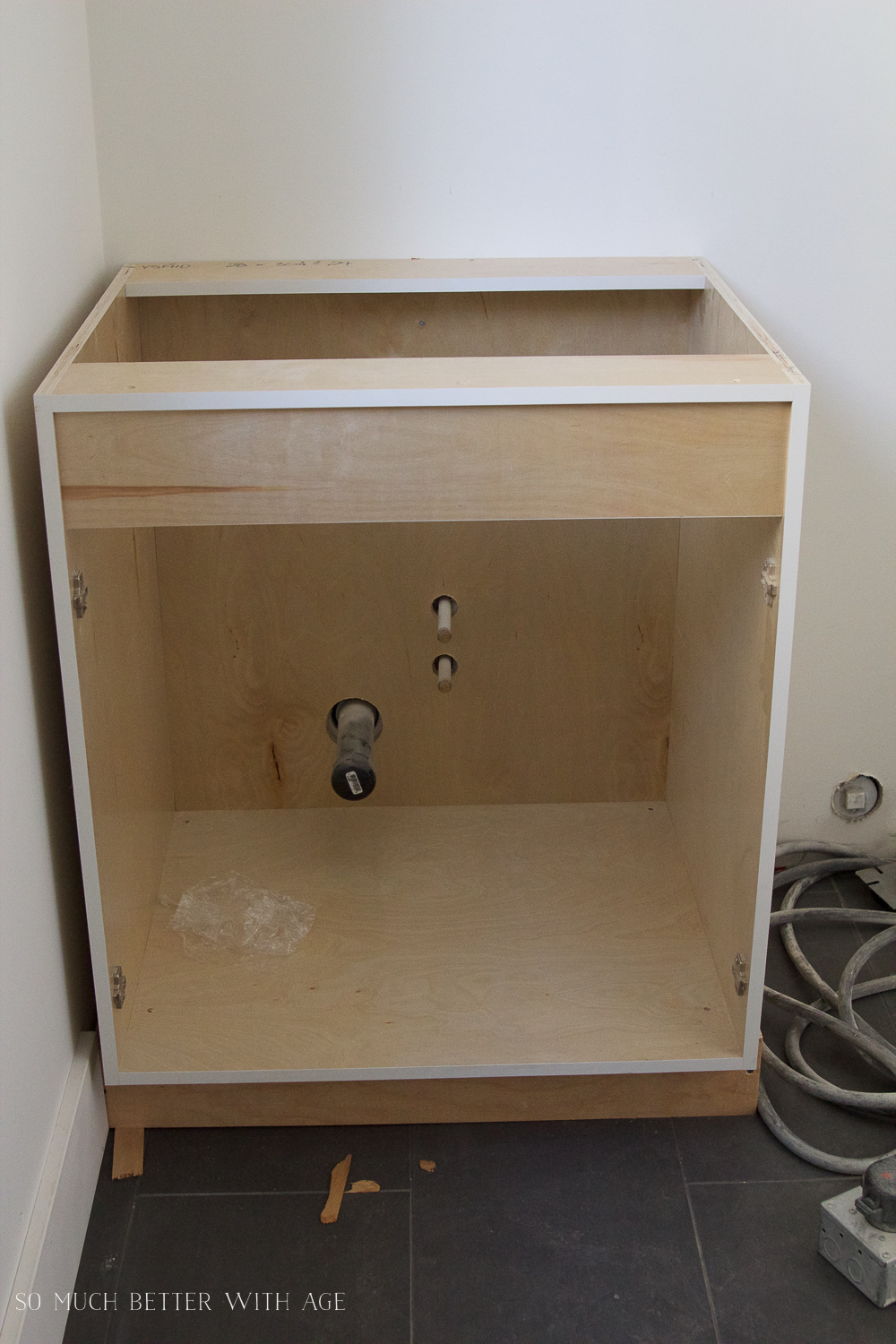 Building a cabinet around the small sink.