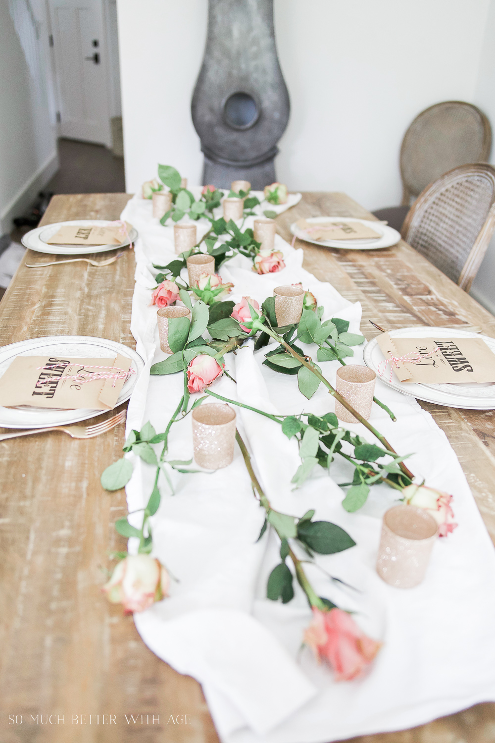 Scattering the roses organically on the table.