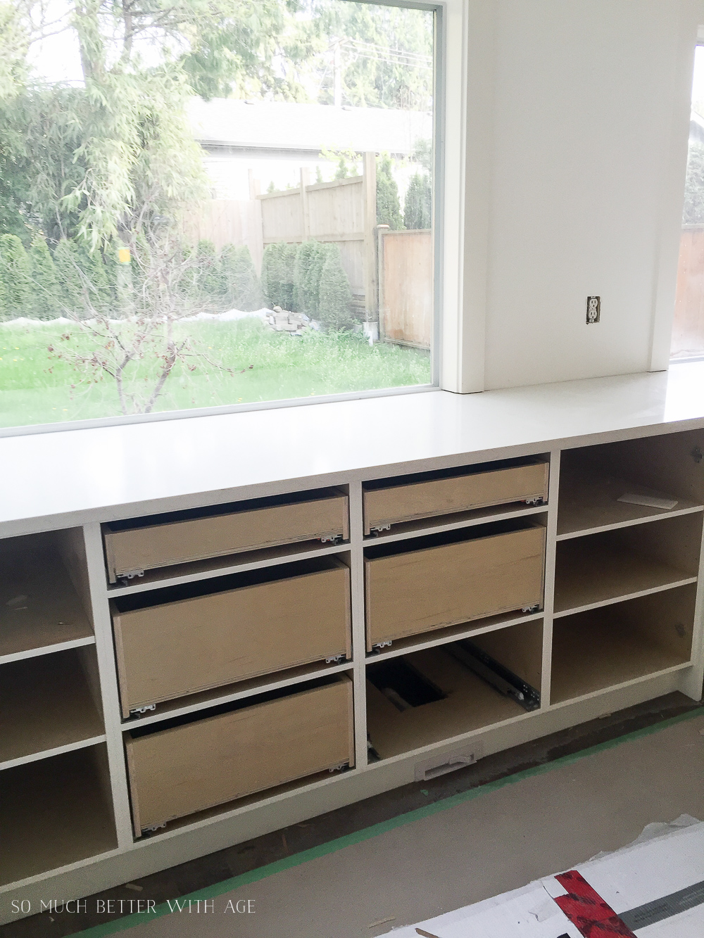 A large window to the back yard in the kitchen.