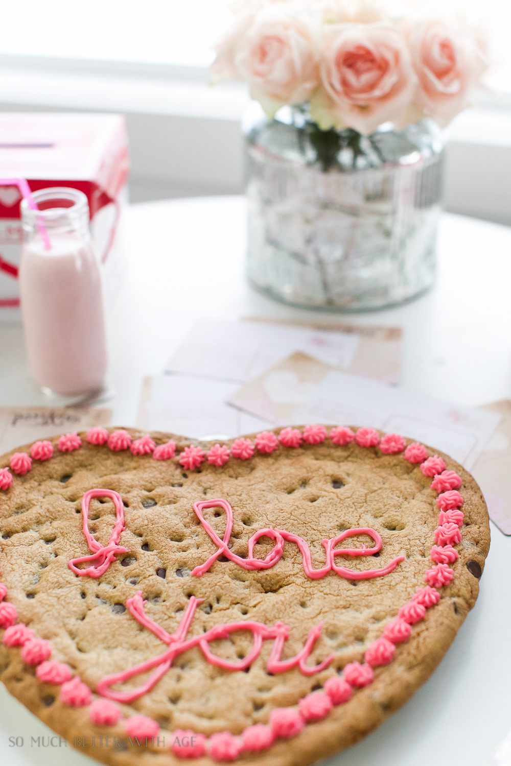 Pretty pink rosettes on a just baked cookie.