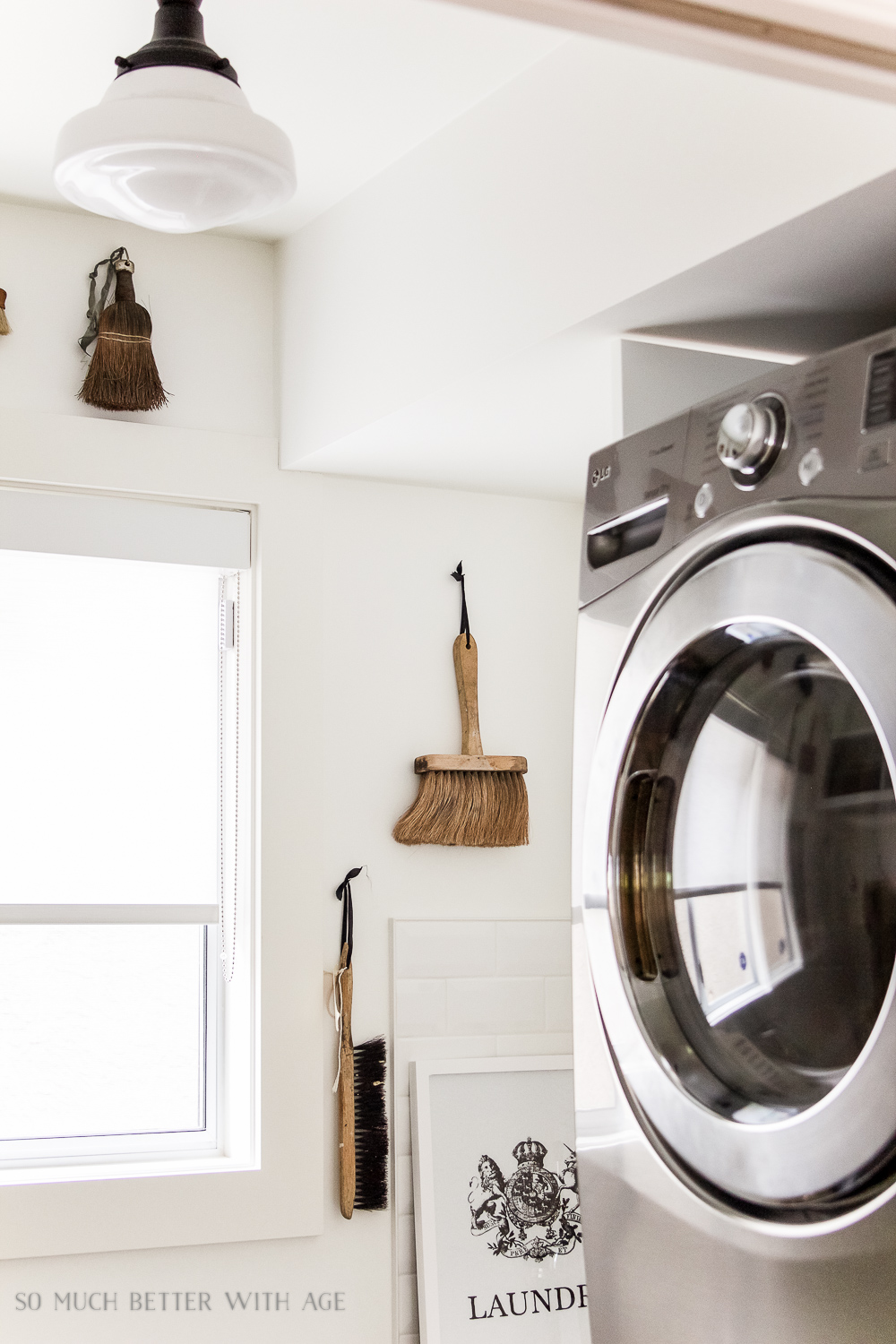 There are brushes on the wall in the laundry room.