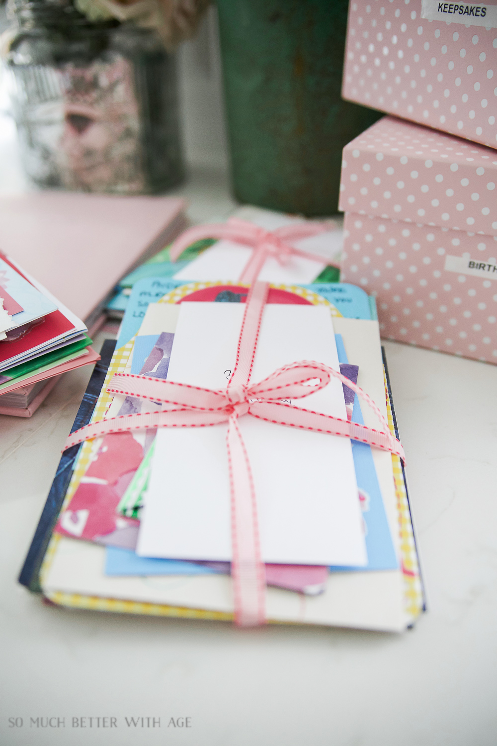 A pretty pink ribbon around birthday cards.