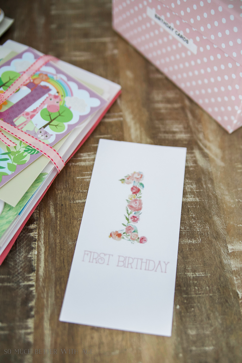 A first birthday card on the table.