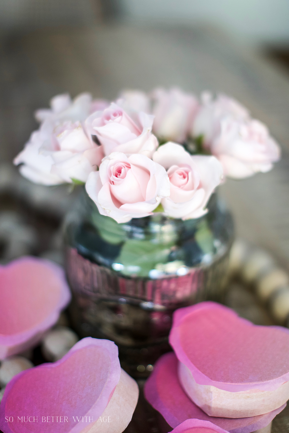 Up close shot of pink roses in a vase.