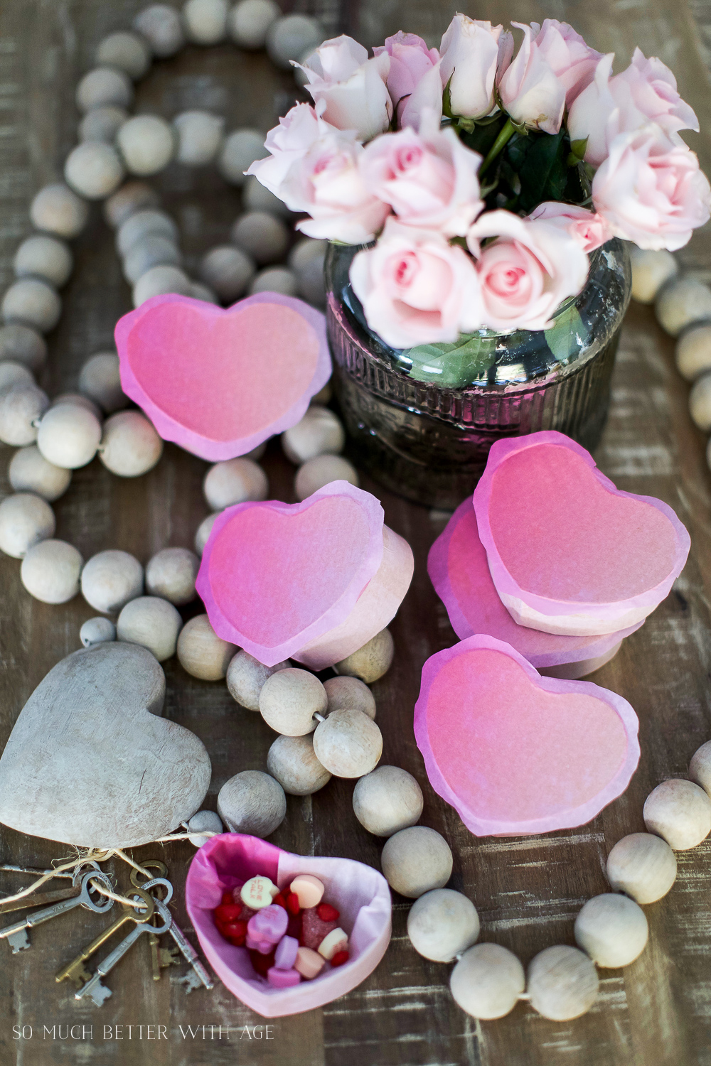 Flowers, and wooden hearts on the table.