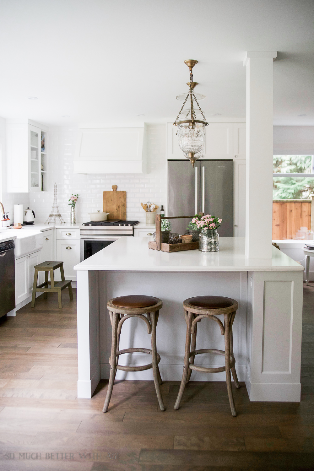 A large kitchen island with a small spring vignette on it.