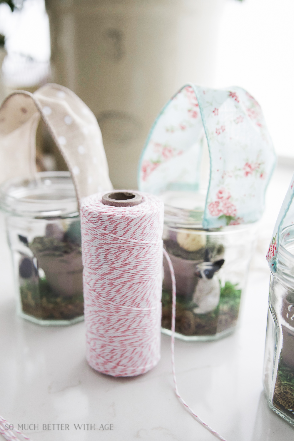 A spool of twine beside the jars.