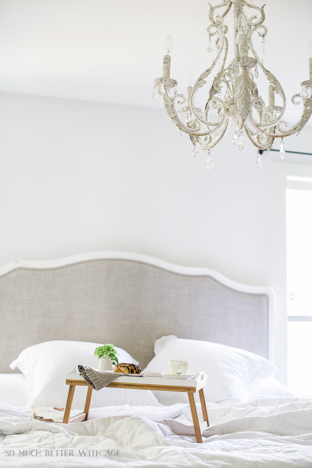 Mother's Day breakfast-in-bed tray with decoupaged kids' art tray on the white bedspread.