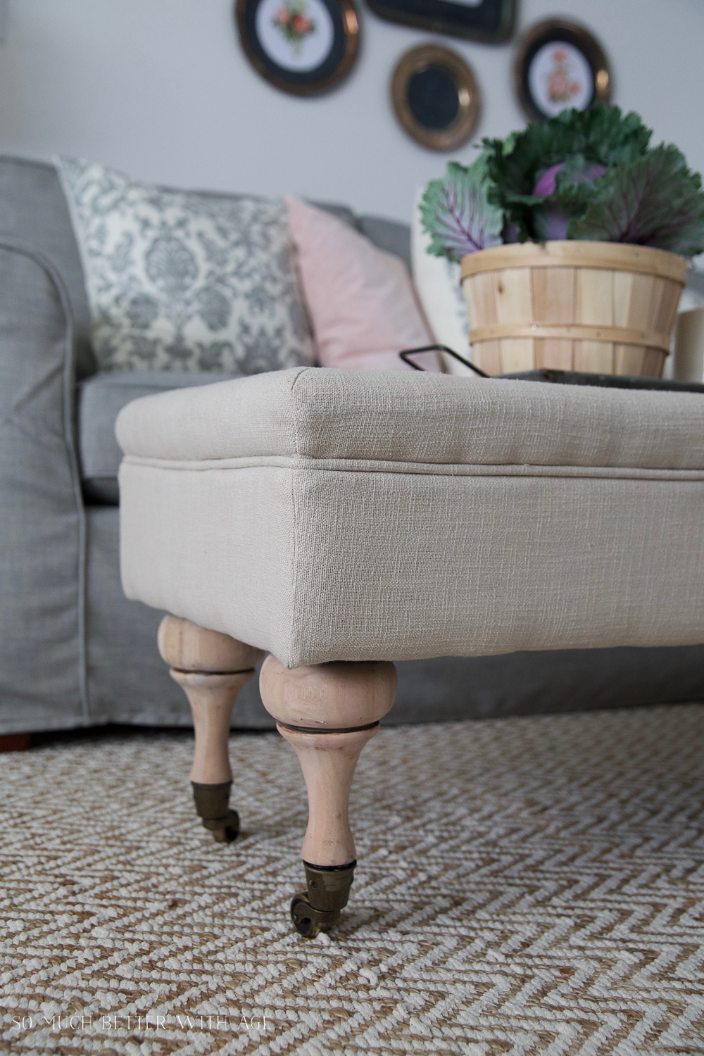 The wooden legs of the ottoman back on the furniture.