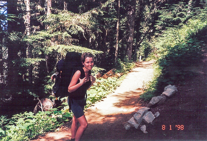 Me hiking with backpack on walking on a trail.