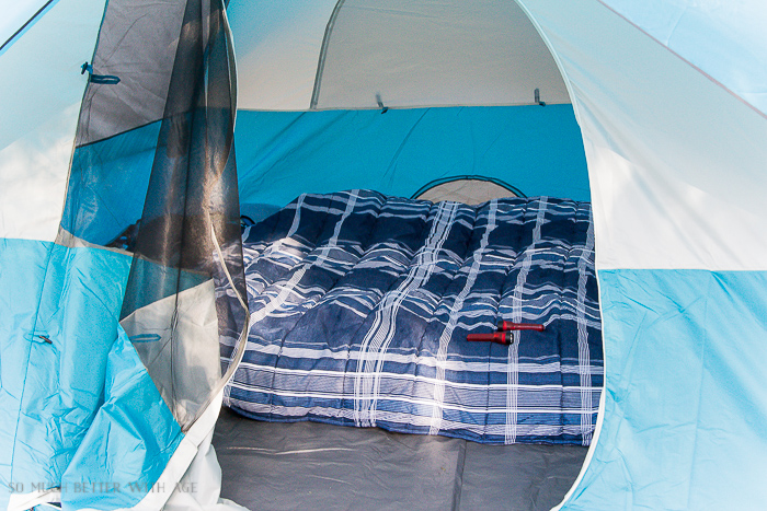 Setting up the bed in the tent.