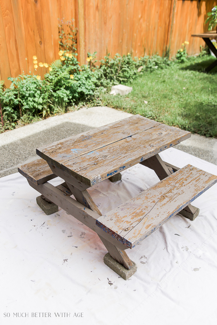 Kids' Picnic Table on a drop sheet outside on the patio.