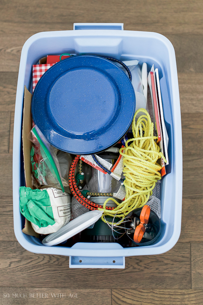 Plates and rope in blue bin.