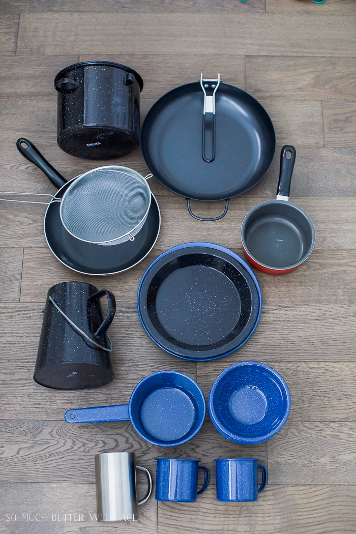 Pots and pans laid out on floor for packing.