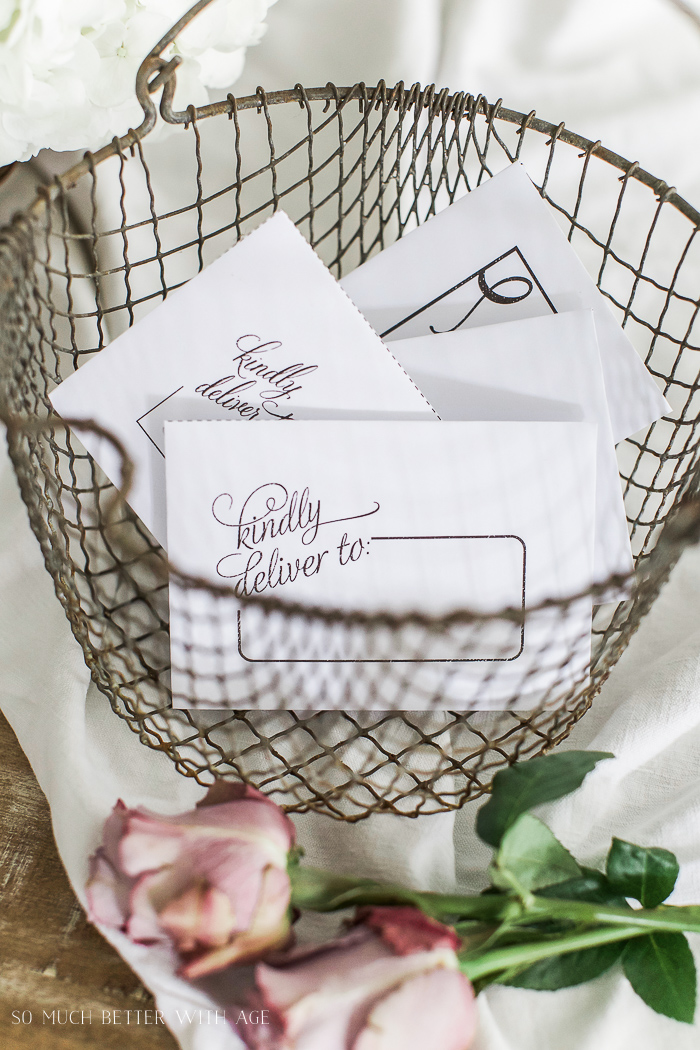 A wire basket is on the table with the cards inside.