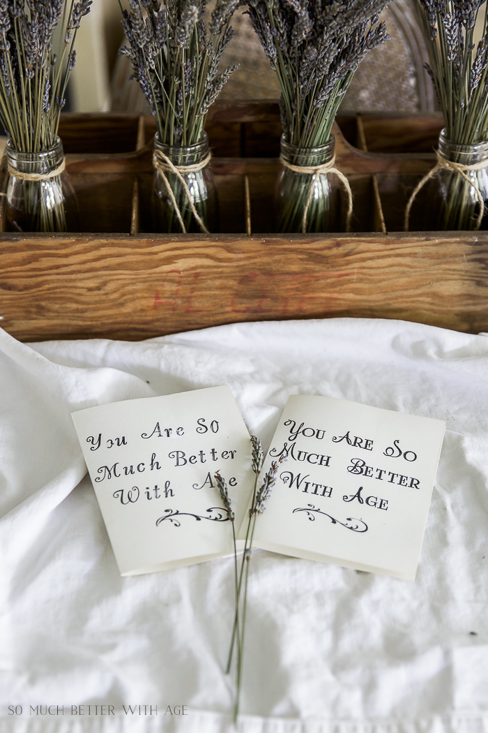 Jars of lavender are lined up behind the stamped cards.