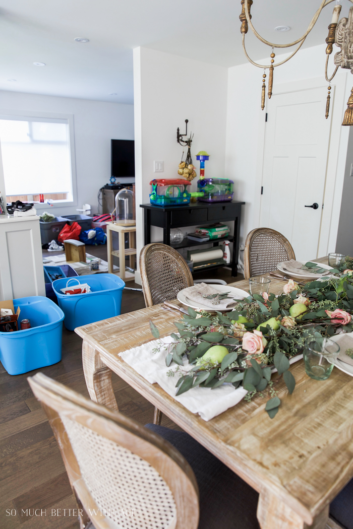 There are blue bins just off to the side of the dining room.