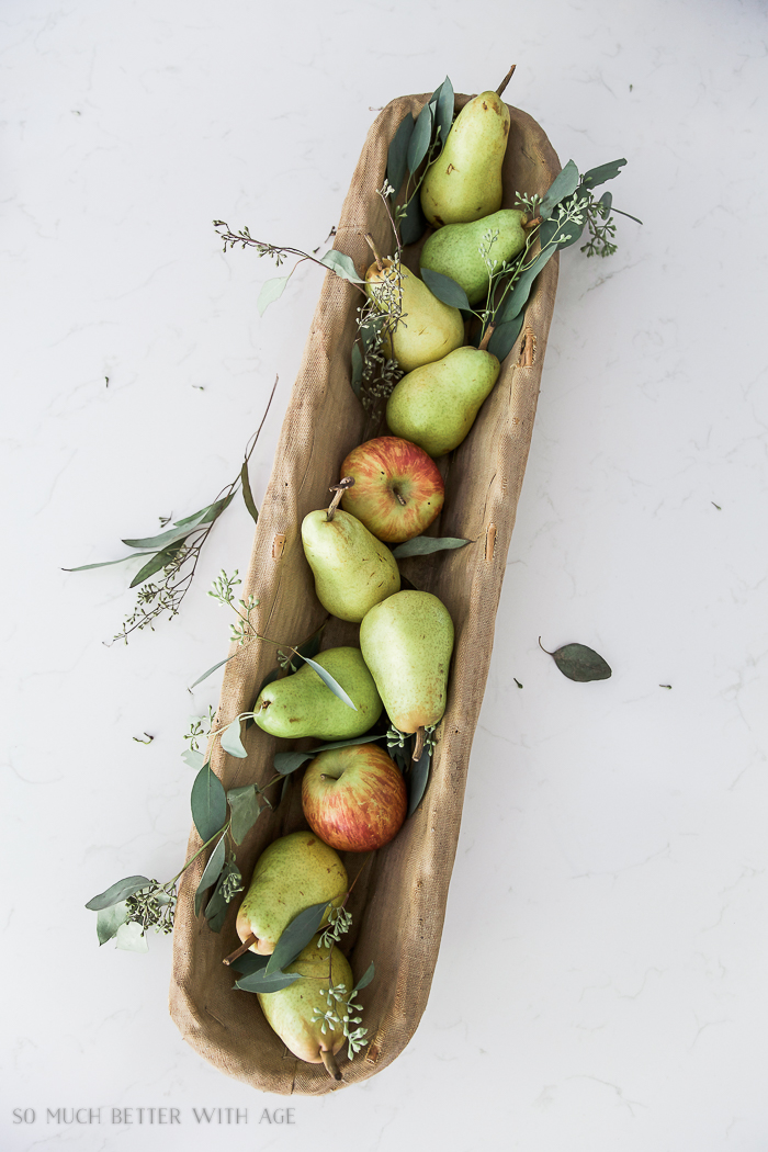  Pears and apples in baguette basket.