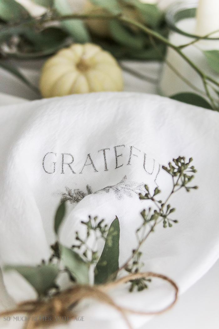 Grateful napkins on table setting.