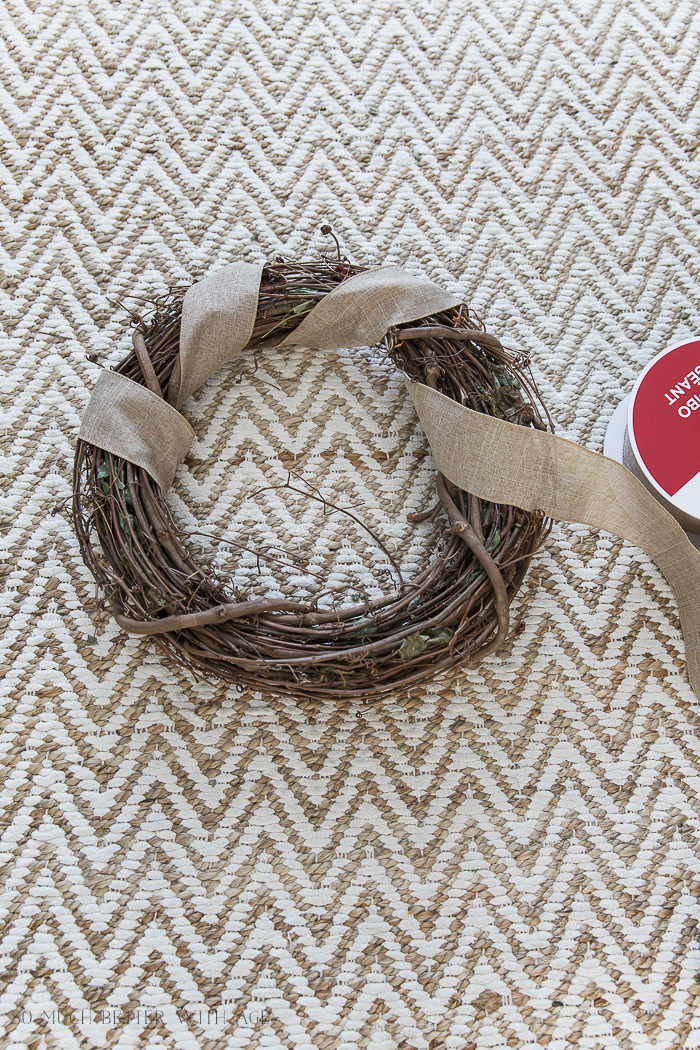 Wrapping the burlap around the wreath.