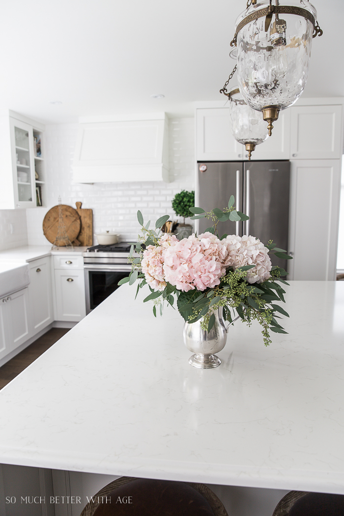 Canadian Spring Tour/ white kitchen, pink hydrangeas - So Much Better With Age