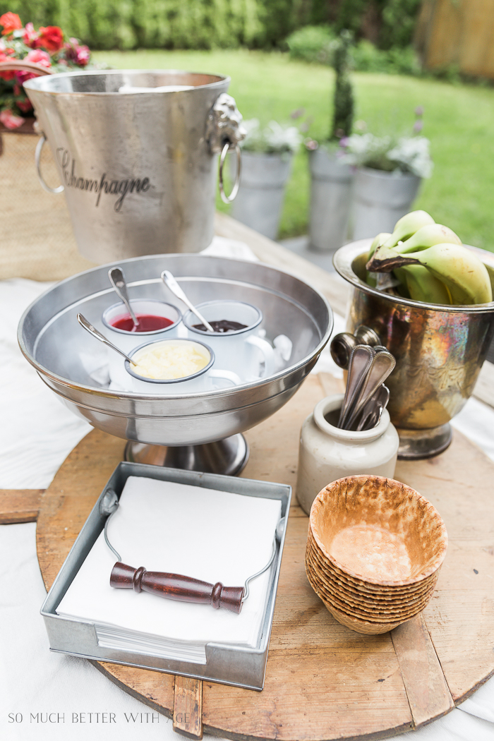 Party supplies on outdoor table. 