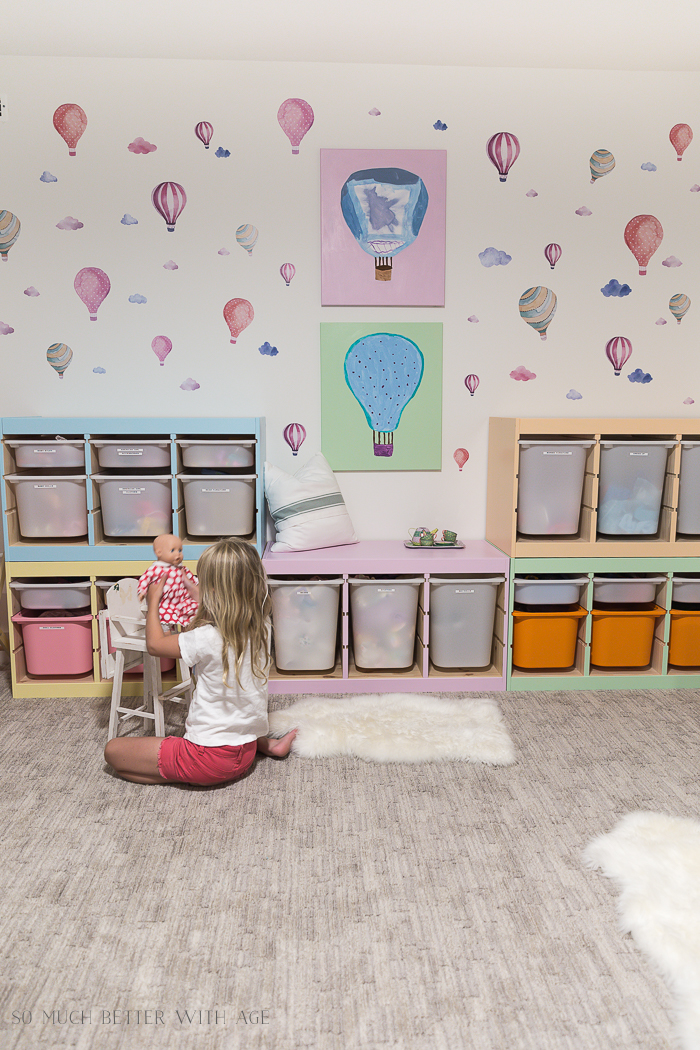 Kids' Playroom Makeover with Hot Air Balloons/girl playing with doll - So Much Better With Age