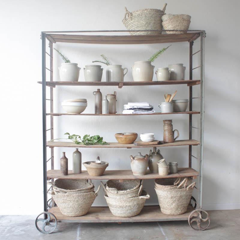 French pottery and baskets on vintage baker's rack by Elsie Green.