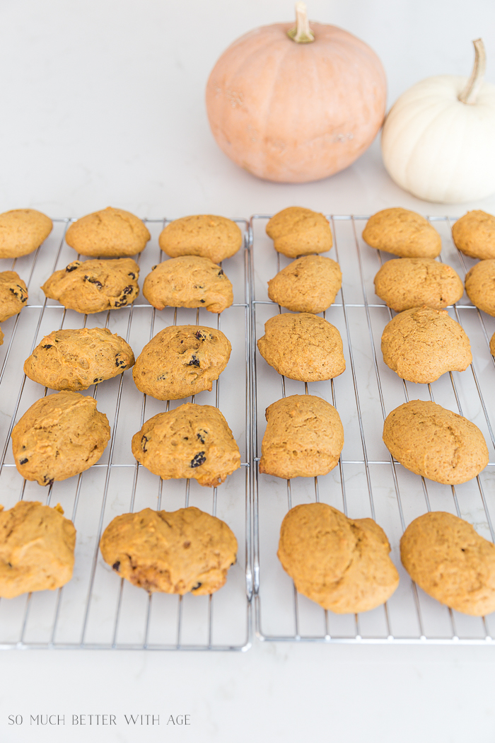 Pumpkin cookies with raisins and without on a cooling rack.