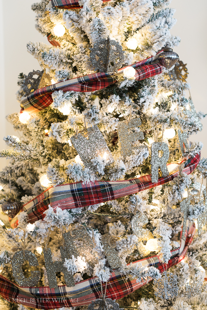 Merry Christmas glitter decorations on the tree.