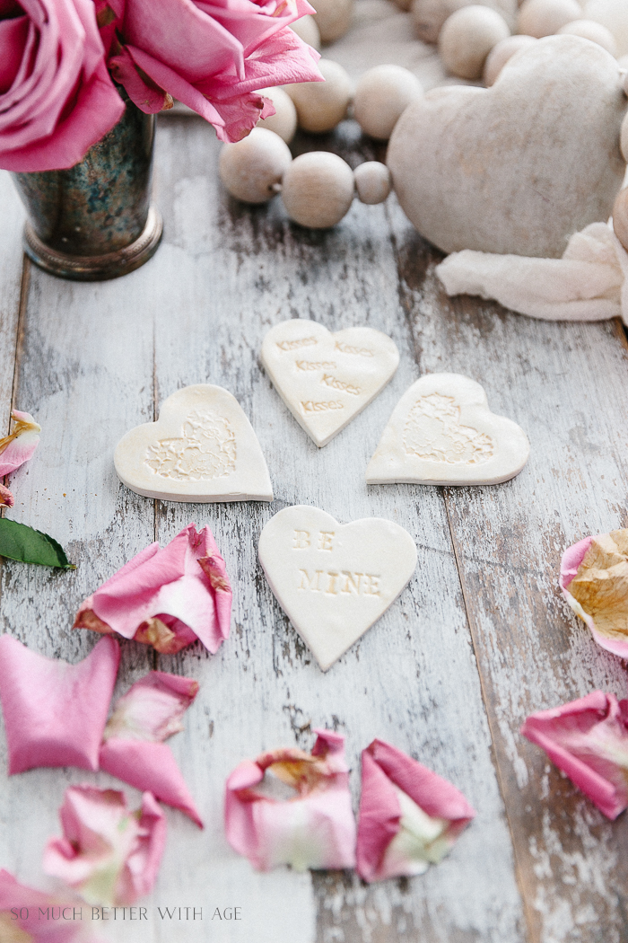 The mini hearts with decorations etched inside them.