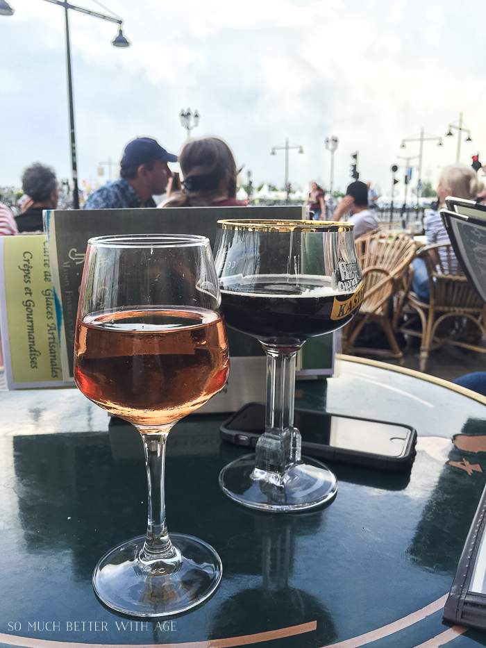 Two glasses of wine in a cafe.