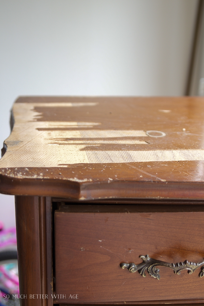 Wood veneer coming off top of dresser. 