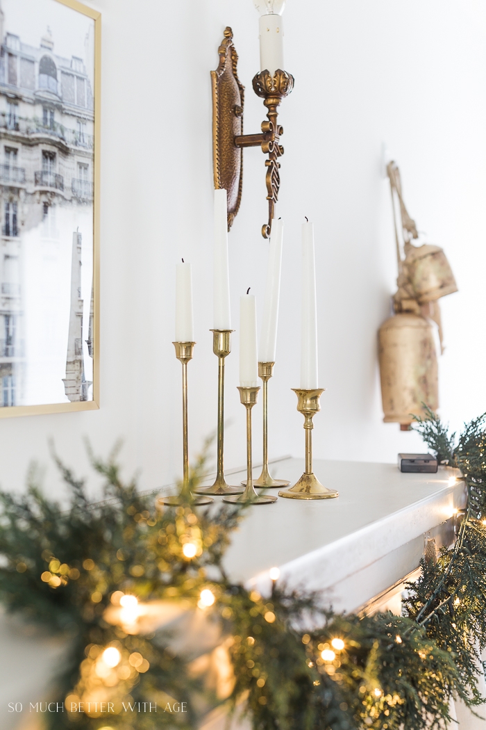 Brass candle holders and wall sconce with bells. 