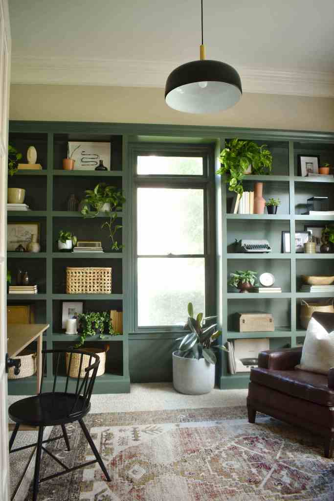 Green painted bookshelves by House on Longwood Lane. Pinecone Hill by Behr. 