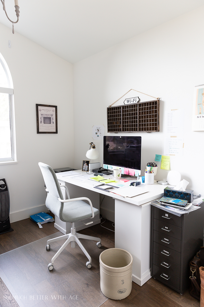 White desk and white walls in office.