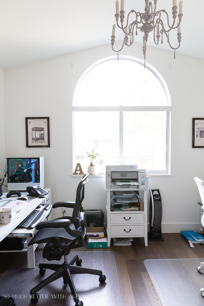 Vaulted ceiling and chandelier in office.