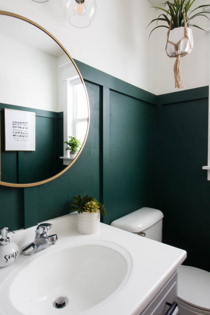 Green painted wall in bathroom by Small Stuff Counts. Rainforest by Behr. 